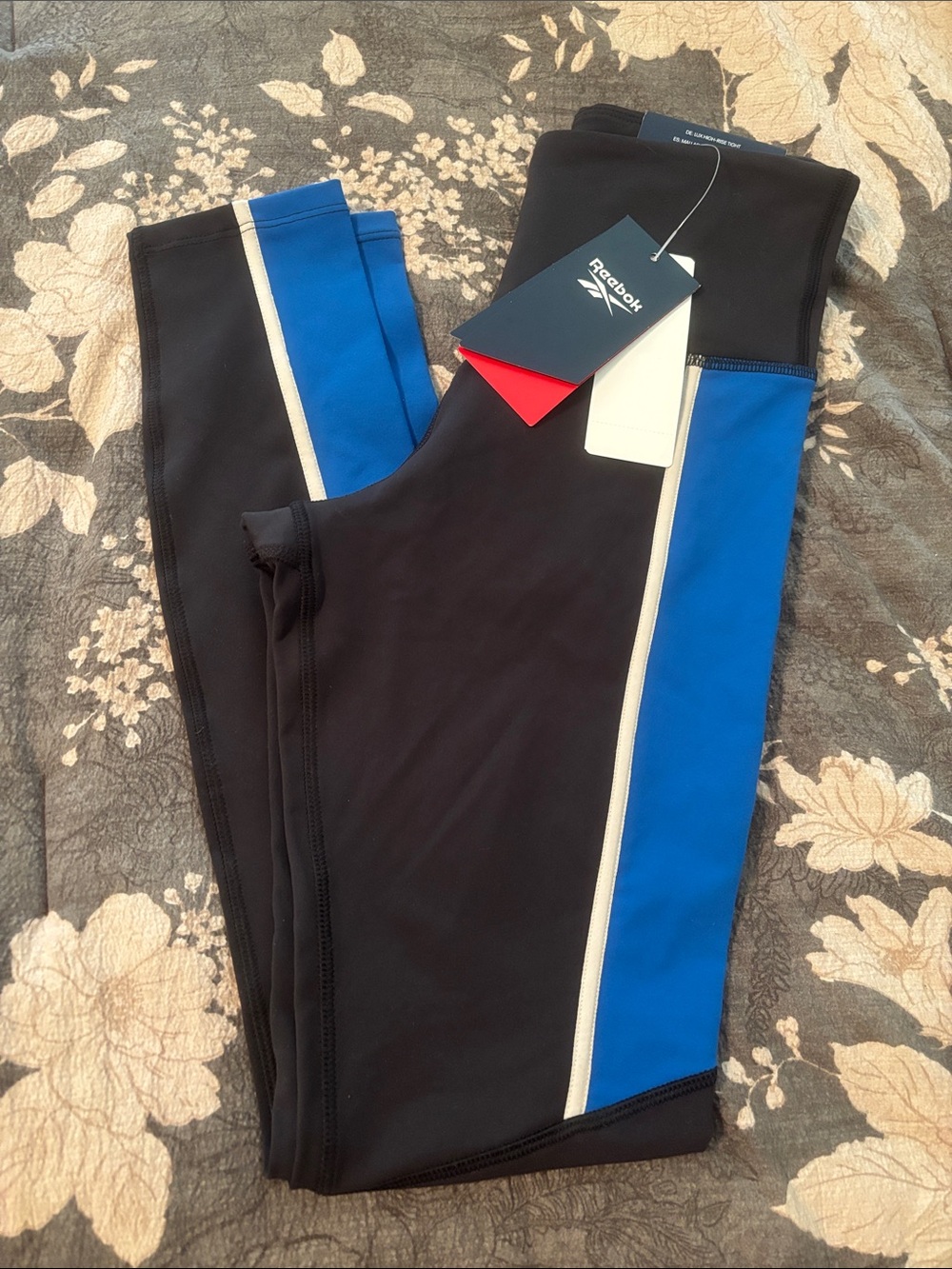 Reebok women’s nwt Black Leggings with Blue and White Side Stripes